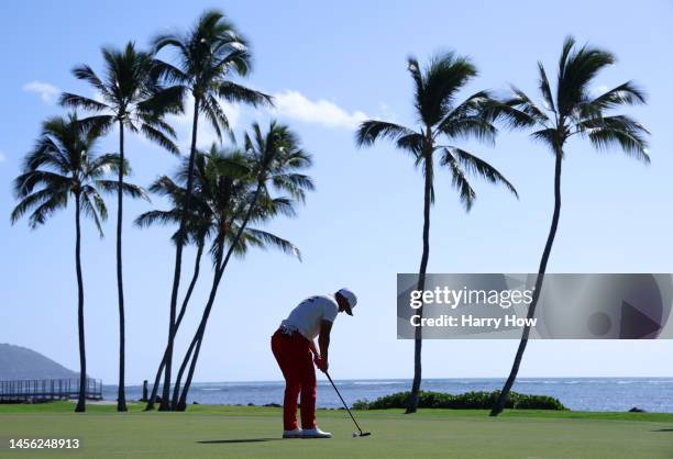 Taiga Semikawa of Japan putts on the 17th green during the second round of the Sony Open in Hawaii at Waialae Country Club on January 13, 2023 in...