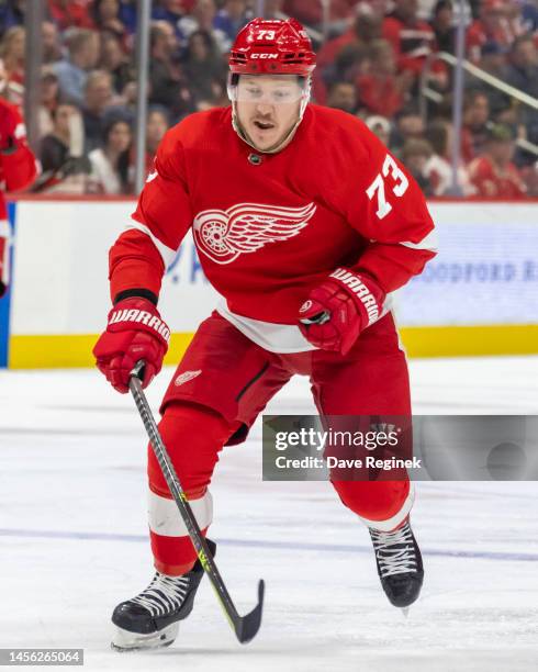 Adam Erne of the Detroit Red Wings skates up ice against the Toronto Maple Leafs during the third period of an NHL game at Little Caesars Arena on...