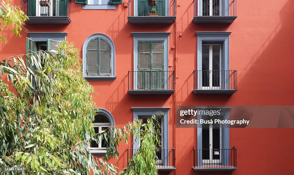 Beautiful facade of ancient residential building in Naples, Italy