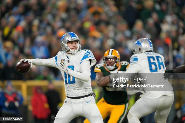 Jared Goff of the Detroit Lions looks to throw a pass against the Green Bay Packers in the first half at Lambeau Field on January 08, 2023 in Green...
