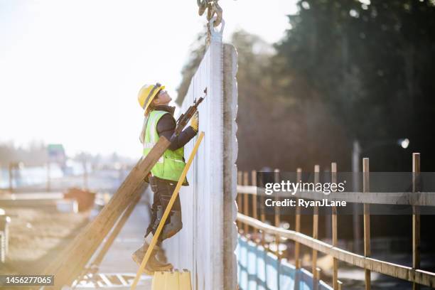 woman working in construction industry - construction worker stock pictures, royalty-free photos & images