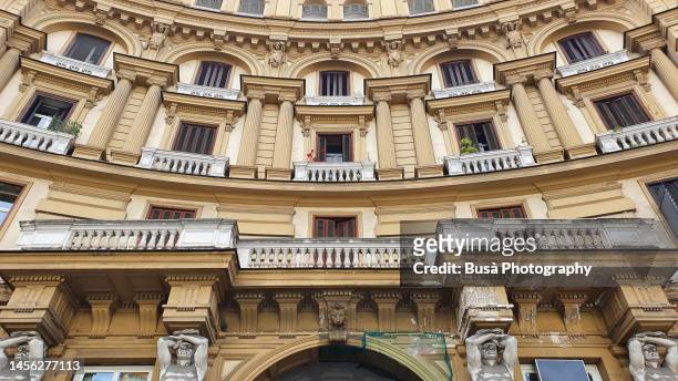 facade of imposing neo-renaissance residential building in piazza nicola amore, along boulevard corso umberto i in naples, italy - amore stock pictures, royalty-free photos & images
