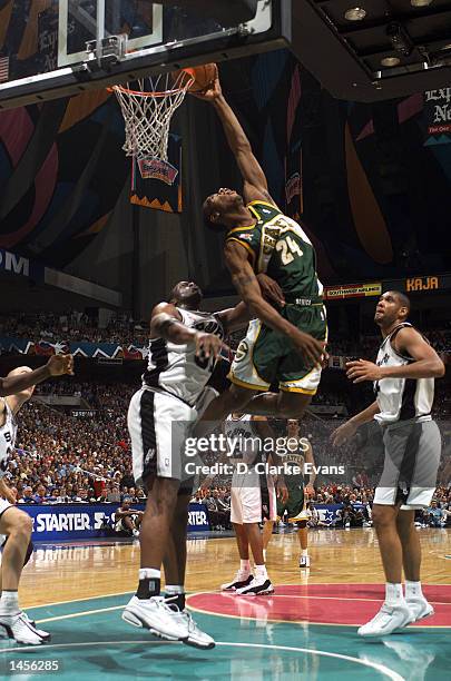 Desmond Mason of the Seattle SuperSonics distorts his body for the shot against the San Antonio Spurs during the 3rd quarter of the game at the...