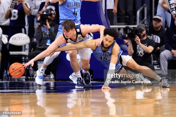 Simas Lukosius of the Butler Bulldogs and Caleb Daniels of the Villanova Wildcats dive for the ball during the first half of the game at Hinkle...