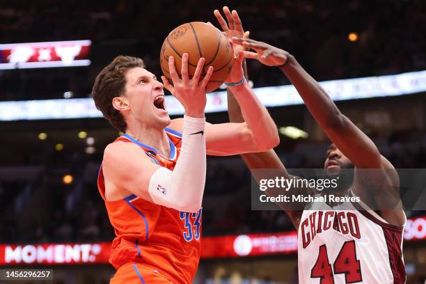 Mike Muscala of the Oklahoma City Thunder shoots over Patrick Williams of the Chicago Bulls during the second half at United Center on January 13,...