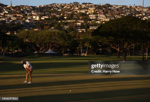 Justin Suh of the United States putts on the 16th green during the second round of the Sony Open in Hawaii at Waialae Country Club on January 13,...