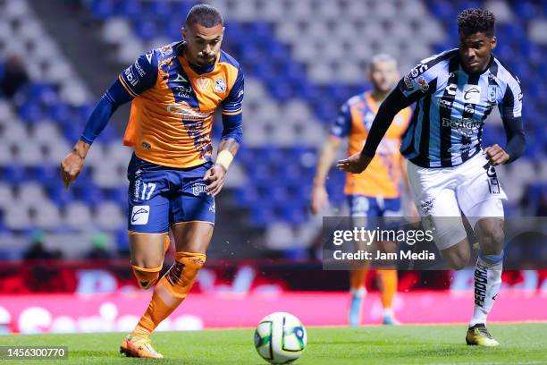 Emanuel Gularte of Puebla fights for the ball with Jose Zuniga of Queretaro during the 2nd round match between Puebla and Queretaro as part of the...