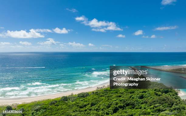aerial view of aqua blue water flooding the river mouth with waves and sandy beach - brunswick heads nsw stock pictures, royalty-free photos & images