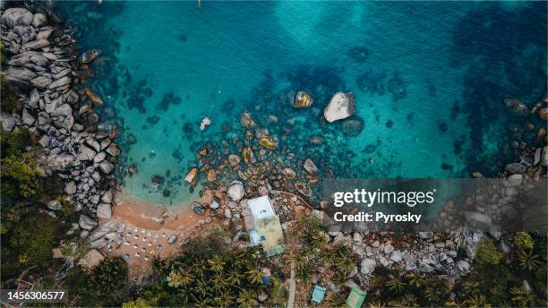 directly above the rocky bay on koh tao, thailand. - private beach stock pictures, royalty-free photos & images