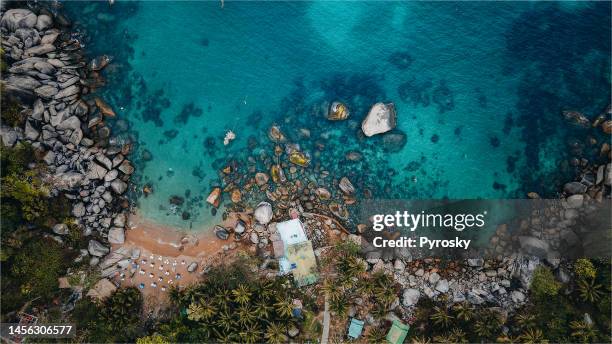 directly above the rocky bay on koh tao, thailand. - private island stock pictures, royalty-free photos & images