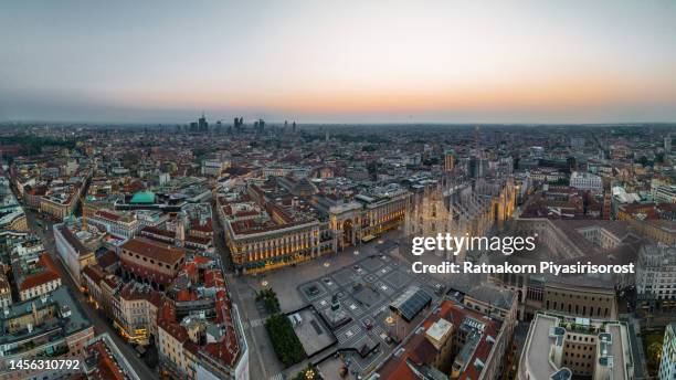 aerial drone piazza del duomo, cathedral square, with milan cathedral or duomo di milano during morning blue hour, milan, lombardia, italy - milan photos et images de collection