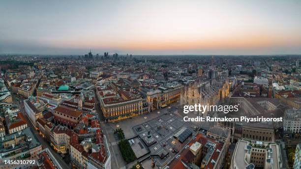 aerial drone piazza del duomo, cathedral square, with milan cathedral or duomo di milano during morning blue hour, milan, lombardia, italy - milan stock pictures, royalty-free photos & images