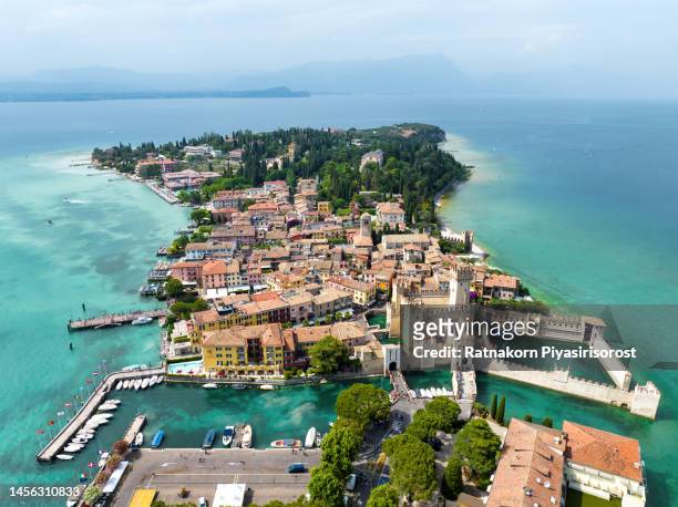 aerial drone view town of sirmione with the scaligero castle on lake garda. province of brescia, lombardia, italy. - sirmione stock pictures, royalty-free photos & images