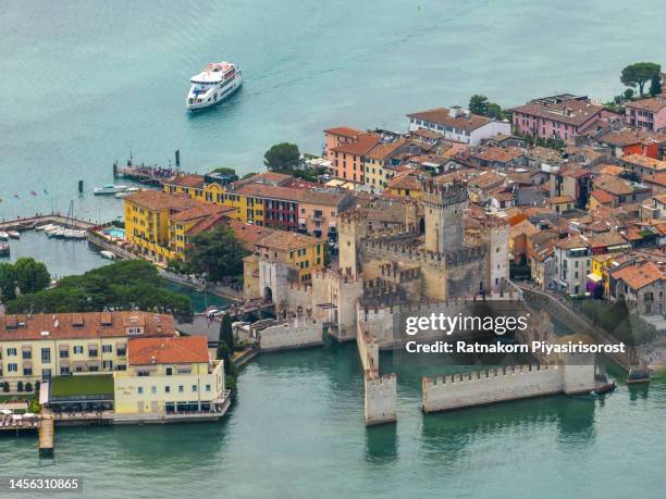 aerial drone view town of sirmione with the scaligero castle on lake garda. province of brescia, lombardia, italy. - garda stock pictures, royalty-free photos & images