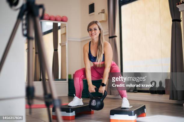 young and beautiful woman exercises - wearable camera stockfoto's en -beelden