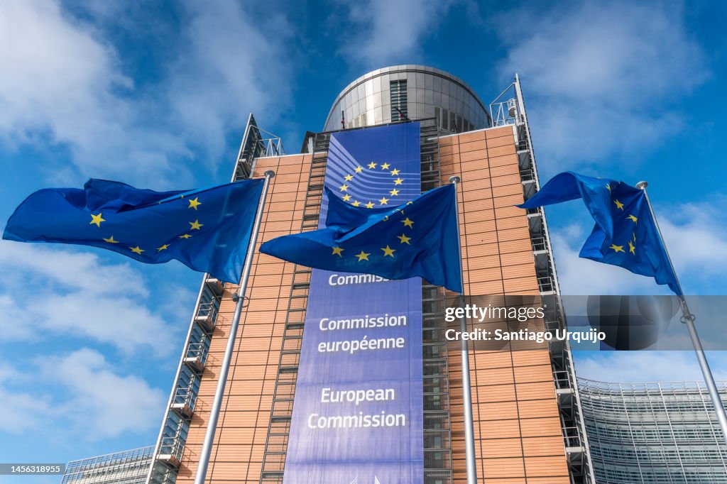 European Union flags waiving in front of Berlaymont building of the European Commission