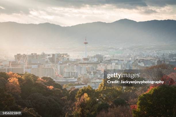 view of the kyoto cityscapes during the twilight in a cloudy day, japan - kyoto station stock pictures, royalty-free photos & images