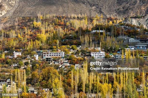 sunrise scene of autumn landscape of hunza valley with  river and karakoram range mountain, hunza valley, gilgit-baltistan, north pakistan. - nanga parbat stock pictures, royalty-free photos & images