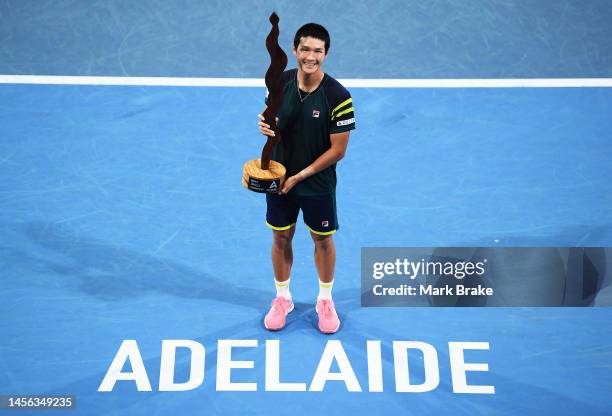 Soonwoo Kwon of Korea poses with the Mens Singles Champion trophy after defeating Roberta Bautista Agut of Spain during day six of the 2023 Adelaide...