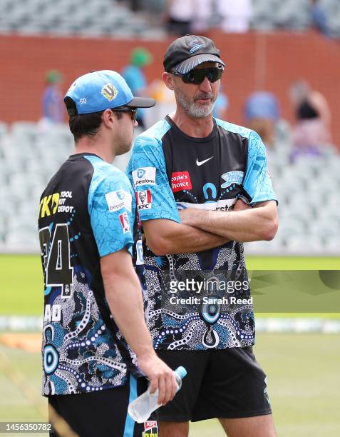 Travis Head of the Strikers and coach Jason Gillespie during the Men's Big Bash League match between the Adelaide Strikers and the Brisbane Heat at...