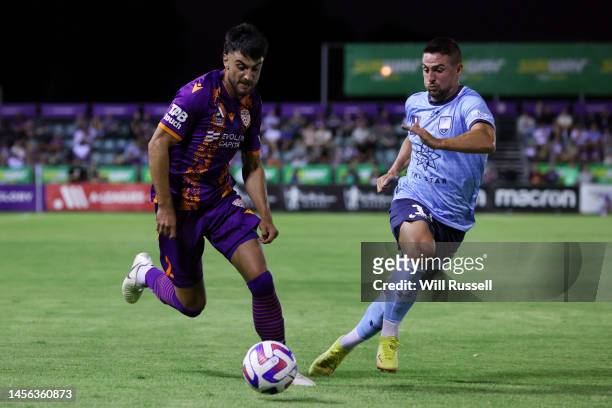 John Koutroumbis of the Glory controls the ball under pressure from Robert Mak of Sydney FC during the round 12 A-League Men's match between Perth...