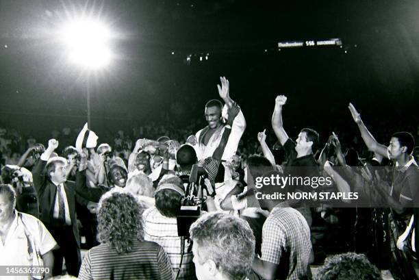 Main Event Match and Winners Circle Evander Holyfield And Dwight Muhammad Qawi on January 17, 1986 in Atlanta Georgia.