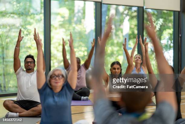 yoga class - yoga group stock pictures, royalty-free photos & images