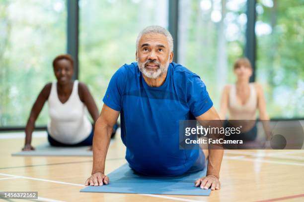 yoga class - aerobics stock pictures, royalty-free photos & images