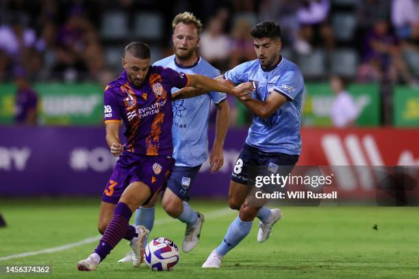 Adam Zimarino of the Glory controls the ball under pressure from Paulo Retre of Sydney FC during the round 12 A-League Men's match between Perth...