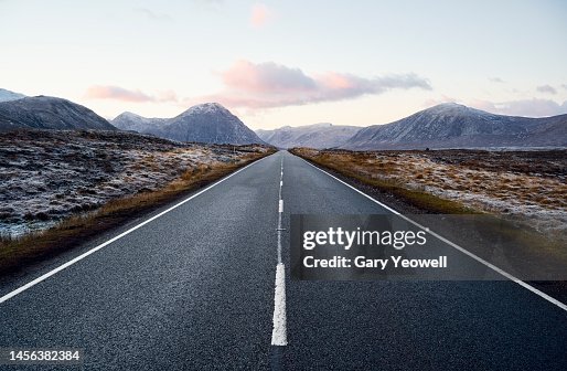 Road leading into the distance in Scottish Highland winter landscape