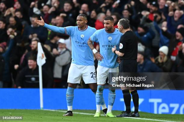 Manuel Akanji and Riyad Mahrez of Manchester City interact with assistant referee, Darren Cann after Bruno Fernandes of Manchester United scores the...
