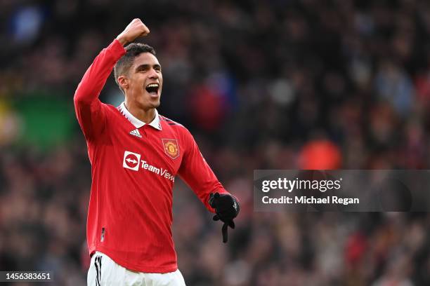 Raphael Varane of Manchester United celebrates after his side's victory in the Premier League match between Manchester United and Manchester City at...