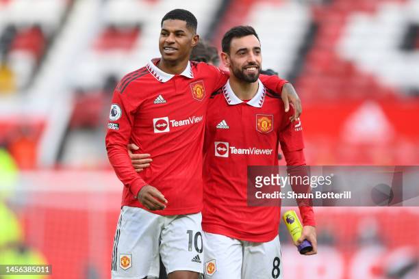 Marcus Rashford and Bruno Fernandes of Manchester United celebrate following their side's victory in the Premier League match between Manchester...