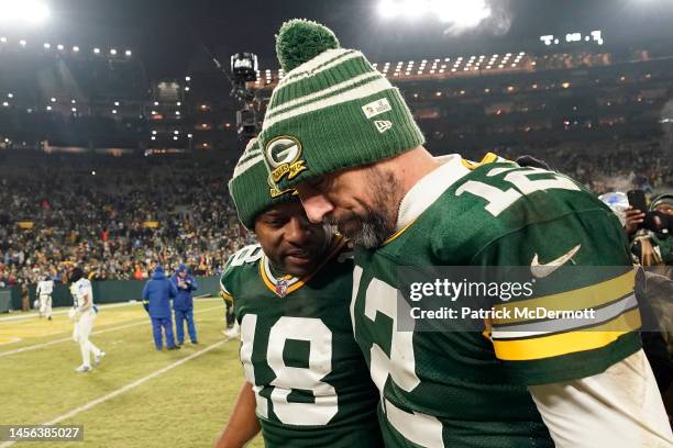 Aaron Rodgers and Randall Cobb of the Green Bay Packers walk off the field after losing to the Detroit Lions at Lambeau Field on January 08, 2023 in...