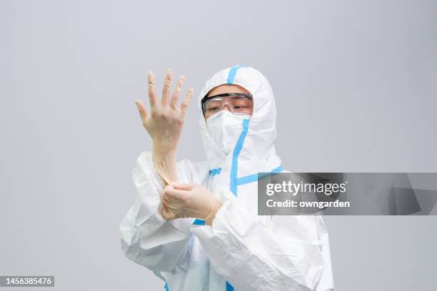 prepare to clean and disinfect the office - white suit stock pictures, royalty-free photos & images