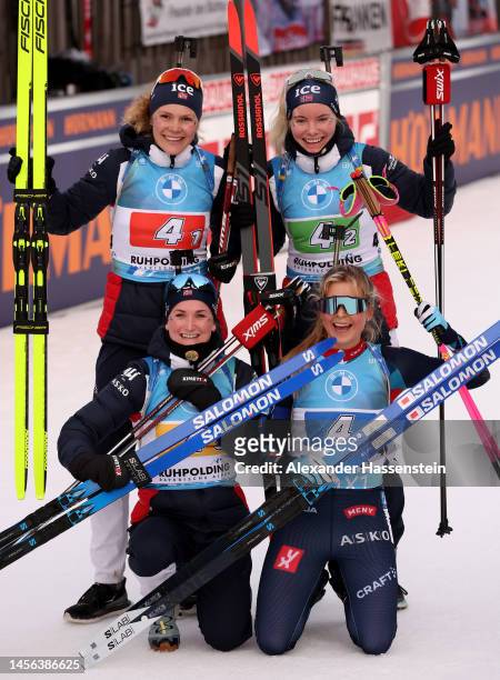 Karoline Offigstad, Ragnhild Femsteinevik, Marte Olsbu Roeiseland and Ingrid Landmark Tandrevold of Norway celebrate 1st place after the Women's 4x6...