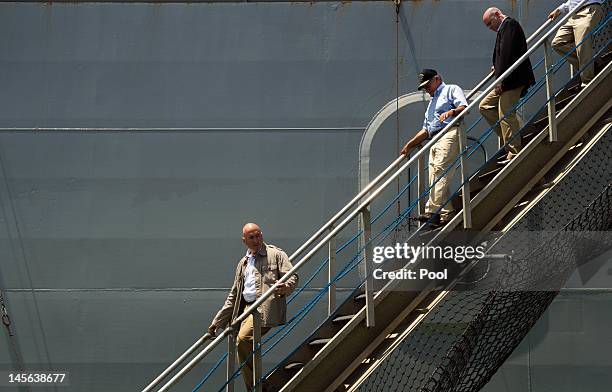 Secretary of Defense Leon Panetta walks down the brow as he disembarks USNS Byrd after visiting with the crew on June 3, 2012 in Cam Ranh Bay,...