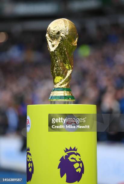 The FIFA World Cup winners trophy is seen on a plinth prior to the Premier League match between Brighton & Hove Albion and Liverpool FC at American...