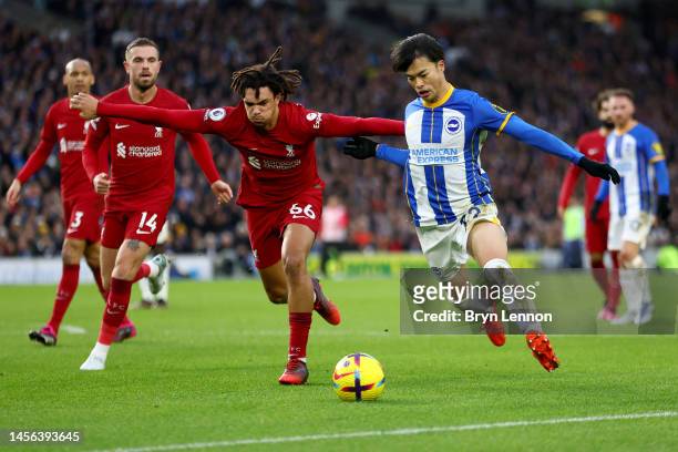Kaoru Mitoma of Brighton & Hove Albion battles for possession with Trent Alexander-Arnold of Liverpool during the Premier League match between...