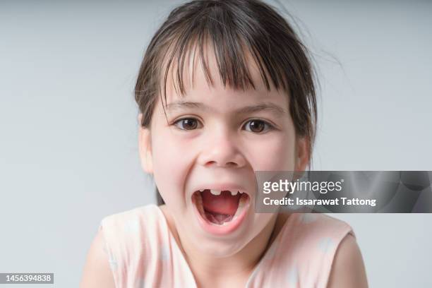 portrait of young excited shocked crazy smiling girl child kid  isolated on white color background - girls open mouth imagens e fotografias de stock