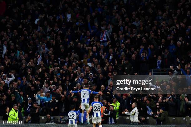 Solly March of Brighton & Hove Albion celebrates with teammates Kaoru Mitoma and Evan Ferguson of Brighton & Hove Albion after scoring the team's...