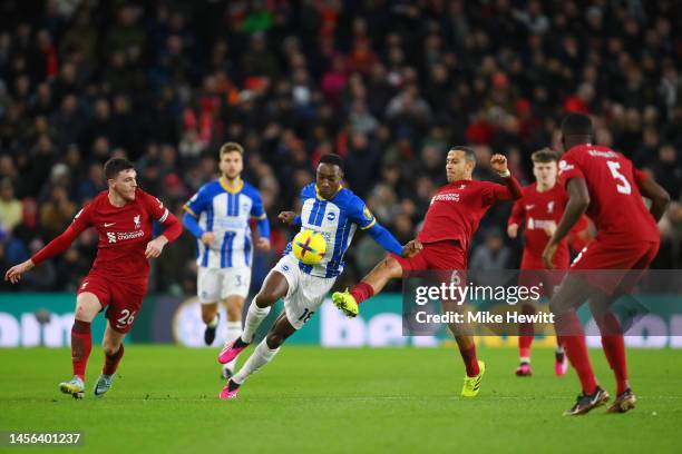 Danny Welbeck of Brighton & Hove Albion battles for possession with Thiago Alcantara of Liverpool during the Premier League match between Brighton &...