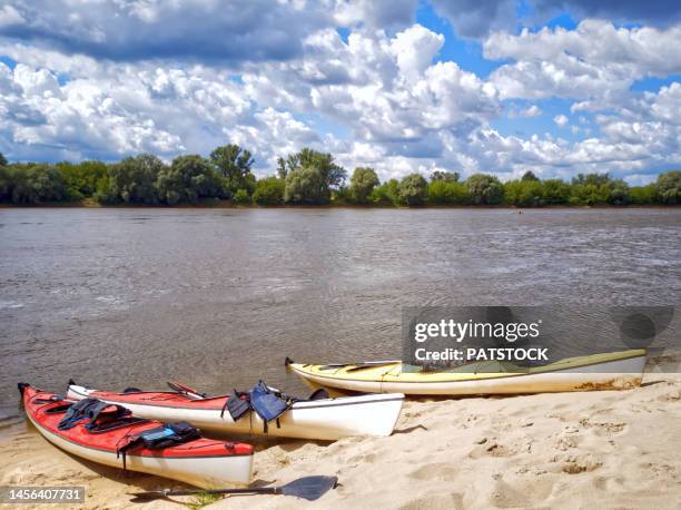 colorful kayaks on the vistula riverbank. - cieszyn stock pictures, royalty-free photos & images