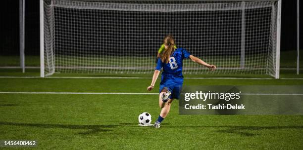 female soccer players - penalty shot - girl goalie stock pictures, royalty-free photos & images