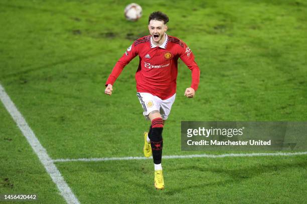 Joe Hugill of Manchester United celebrates after scoring the team's second goal during the Premier League 2 match between Manchester United U21 and...