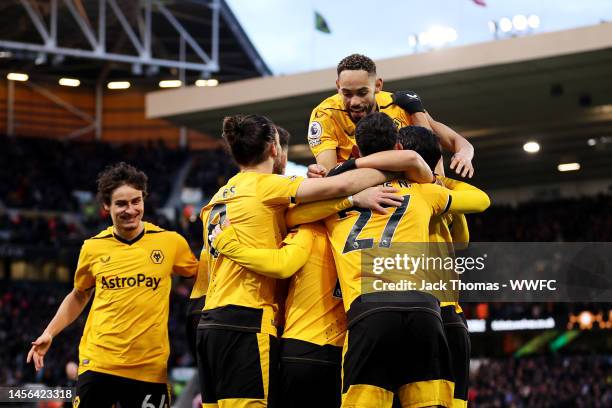 Daniel Podence of Wolverhampton Wanderers celebrates with teammates after scoring his team's first goal during the Premier League match between...