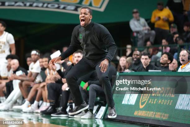 Head coach Kim English of the George Mason Patriots reacts to a call in the second half during a college basketball game against the Davidson...