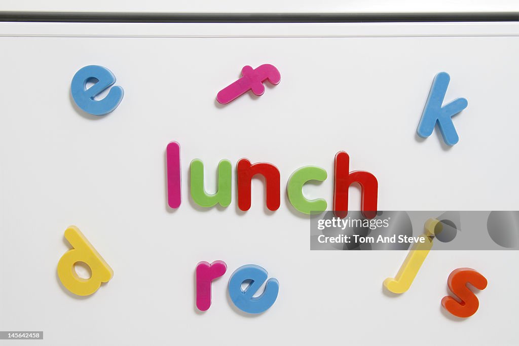 'Lunch' written with magnetic letters on a fridge