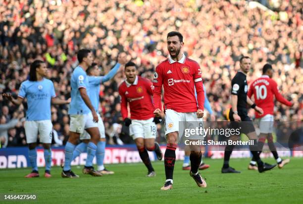 Bruno Fernandes of Manchester United celebrates after scoring the team's first goal during the Premier League match between Manchester United and...