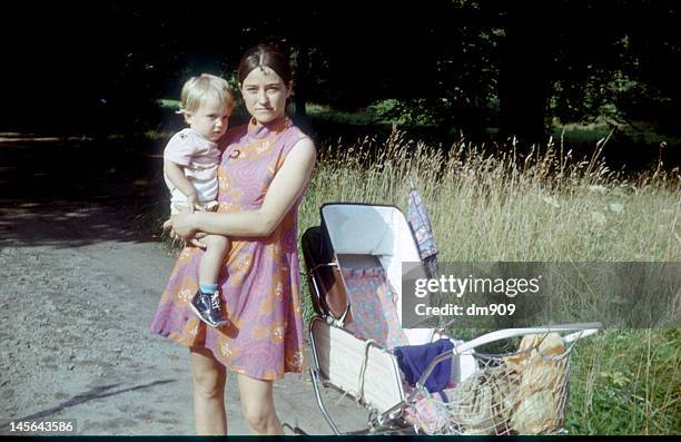 mother holding baby - 1974 stock pictures, royalty-free photos & images